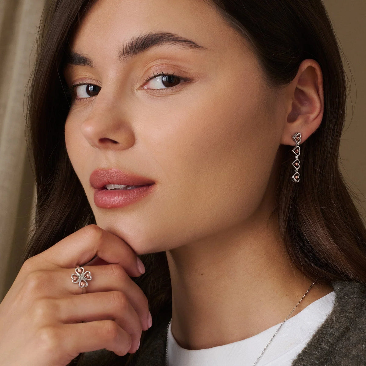 Brunette woman wearing jewelry.