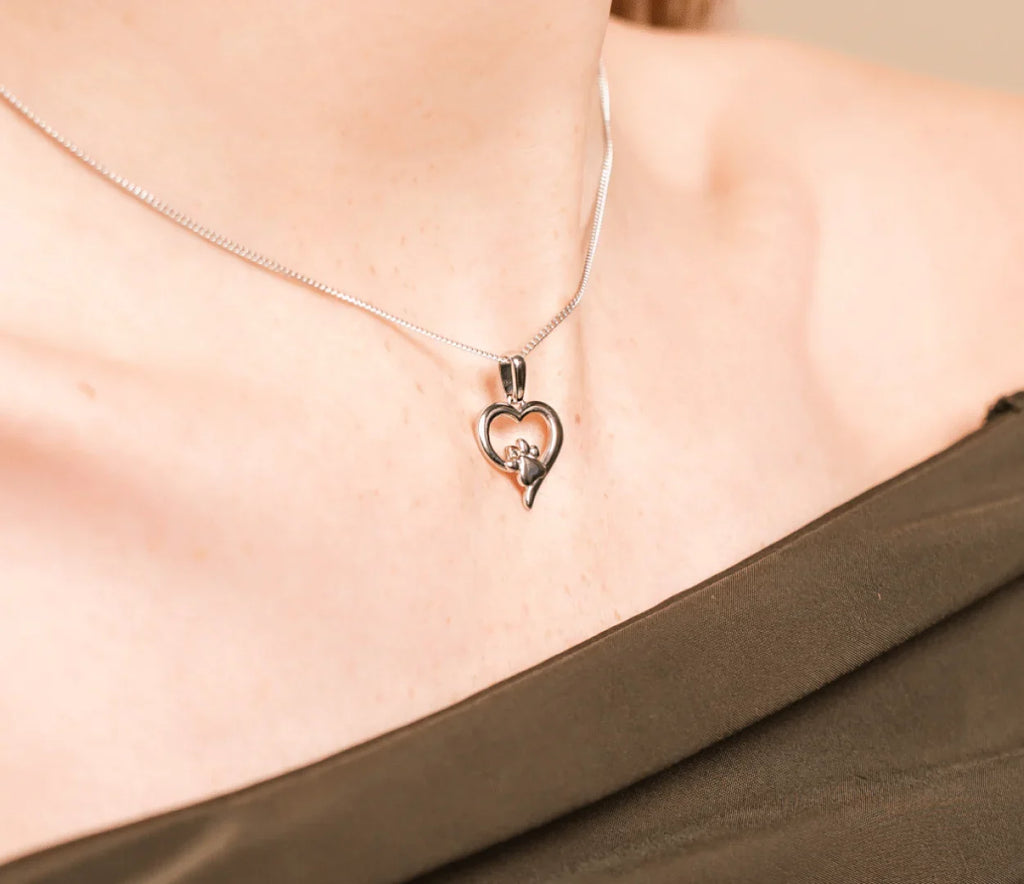 The Clogau Paw Print and Heart Pendant, a silver sterling pendant from Clogau, available at OD’s Jewellers in St Helens
