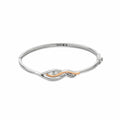 Silver bangle bracelet with rose gold detail and gemstones.
