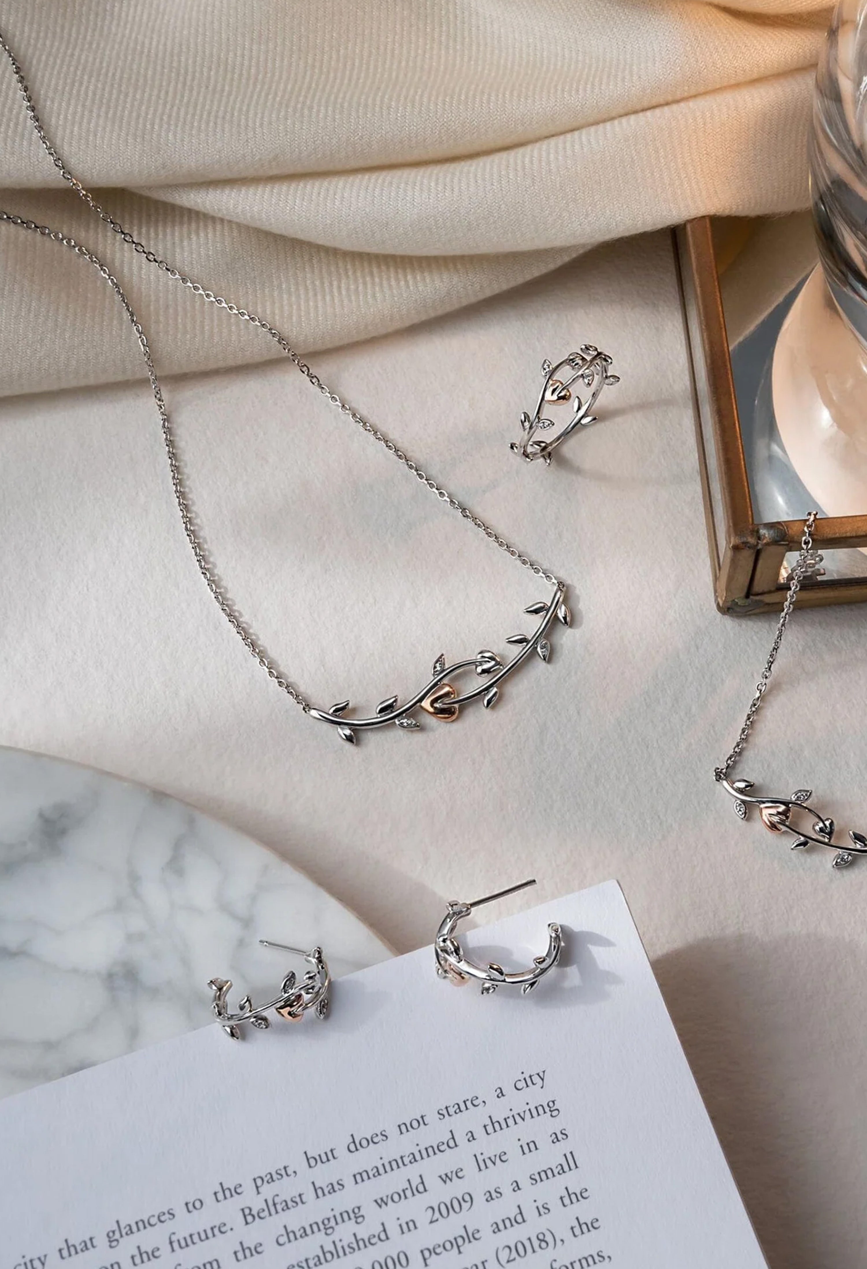 Clogau Tree Of Life Vine Necklace set in sterling silver, featuring matching earrings and ring, showcasing nature-inspired