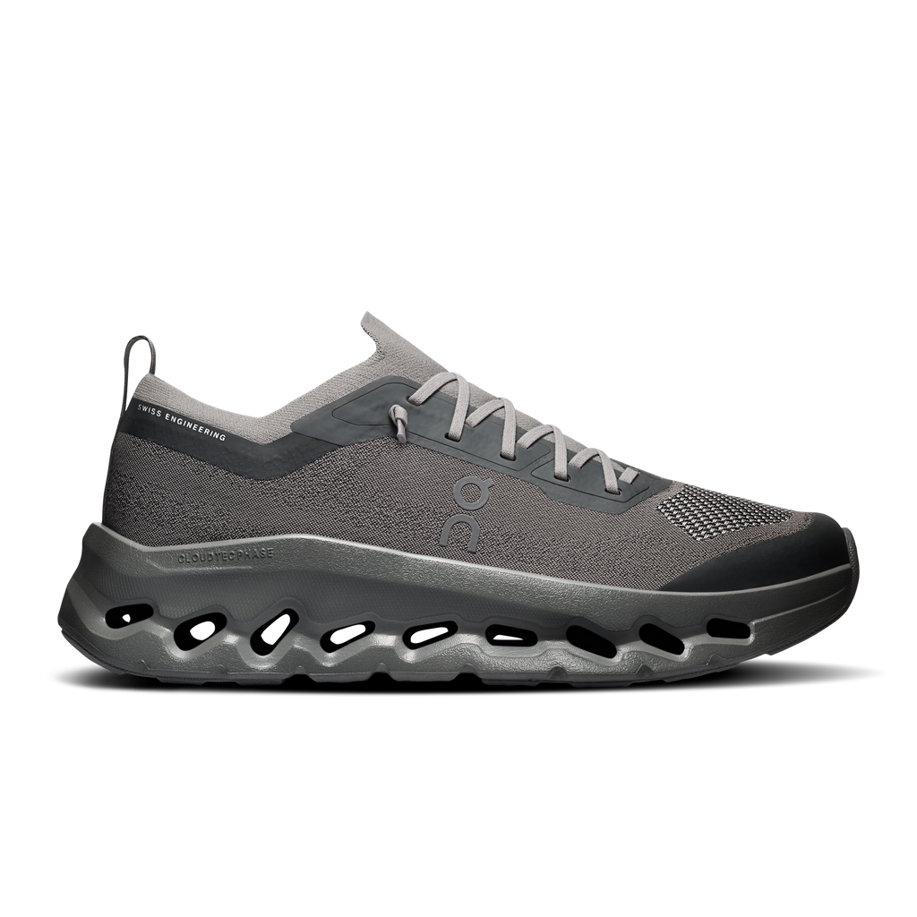 A single On Cloudrunner sneaker in dark gray and black, shown from a side profile on a clean white background.