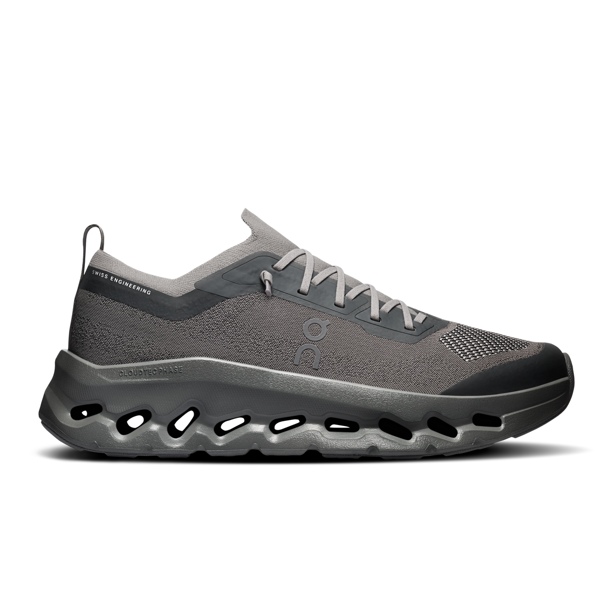 A single On Cloudrunner sneaker in dark gray and black, shown from a side profile on a clean white background.