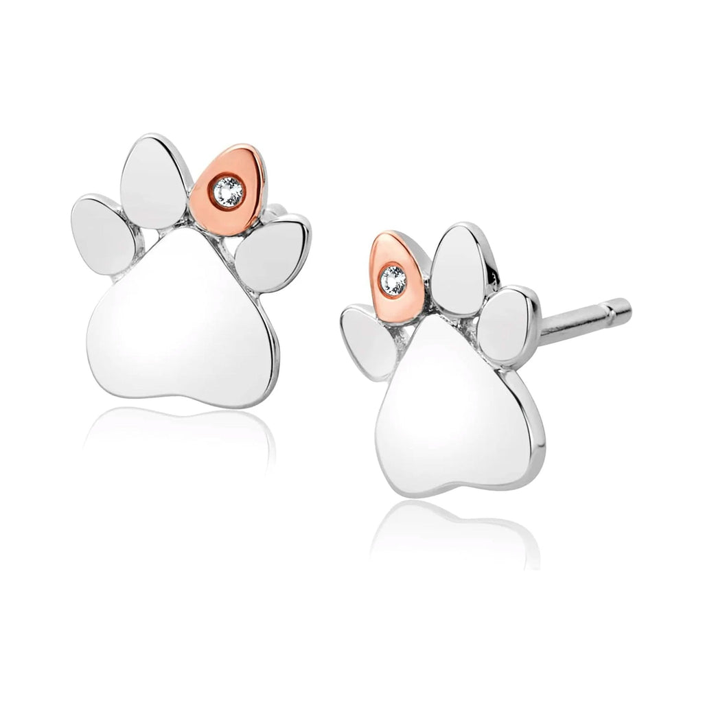 Close-up of Clogau Paw Prints stud earrings in sterling silver with white topaz detail; jewelry product showcase.