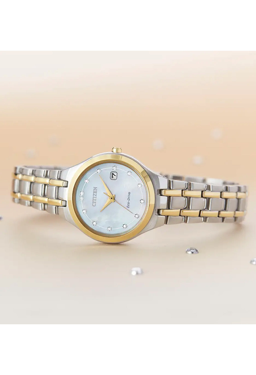 Citizen Eco-Drive ladies watch with mother of pearl dial, diamond accents, and two-tone stainless steel band.