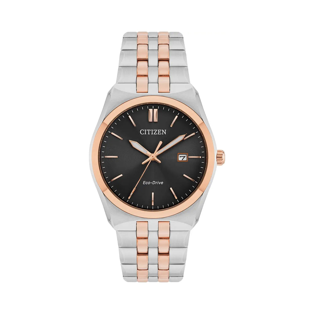 Close-up of the Citizen Eco-Drive watch showcasing its black dial, date display, and two-tone bracelet design.