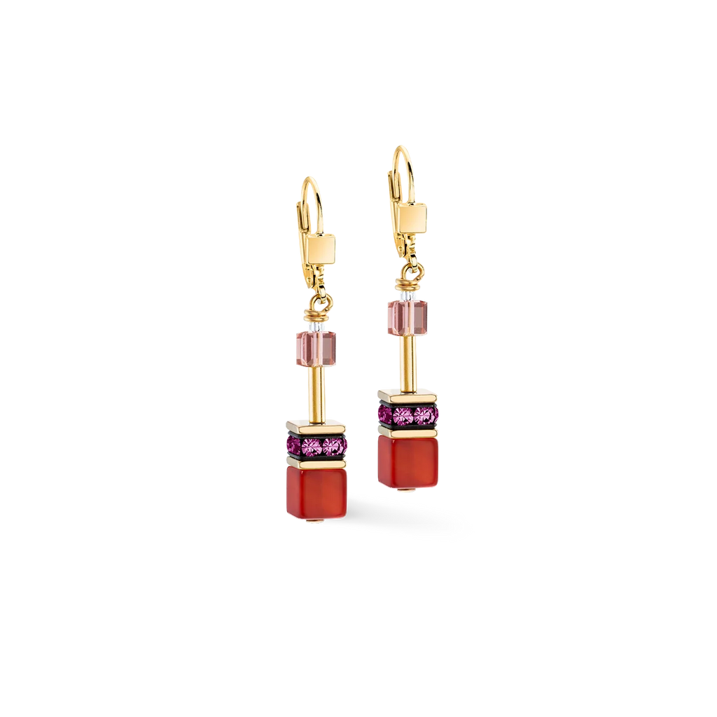 Pair of gold earrings with pink and red cubes.