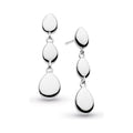 Silver dangle earrings with teardrop pendants.