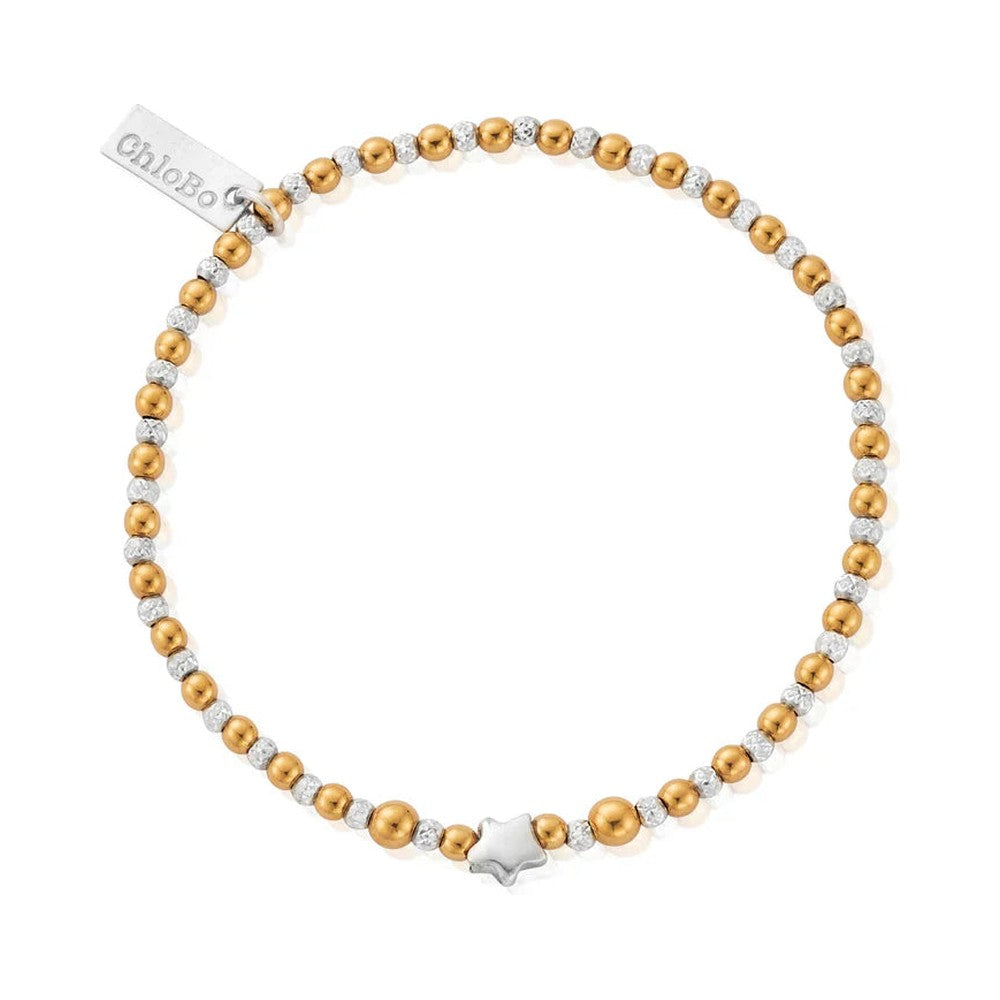 Gold and silver beaded bracelet with a star charm and tag.