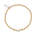 Gold and silver beaded bracelet with a star charm and tag.