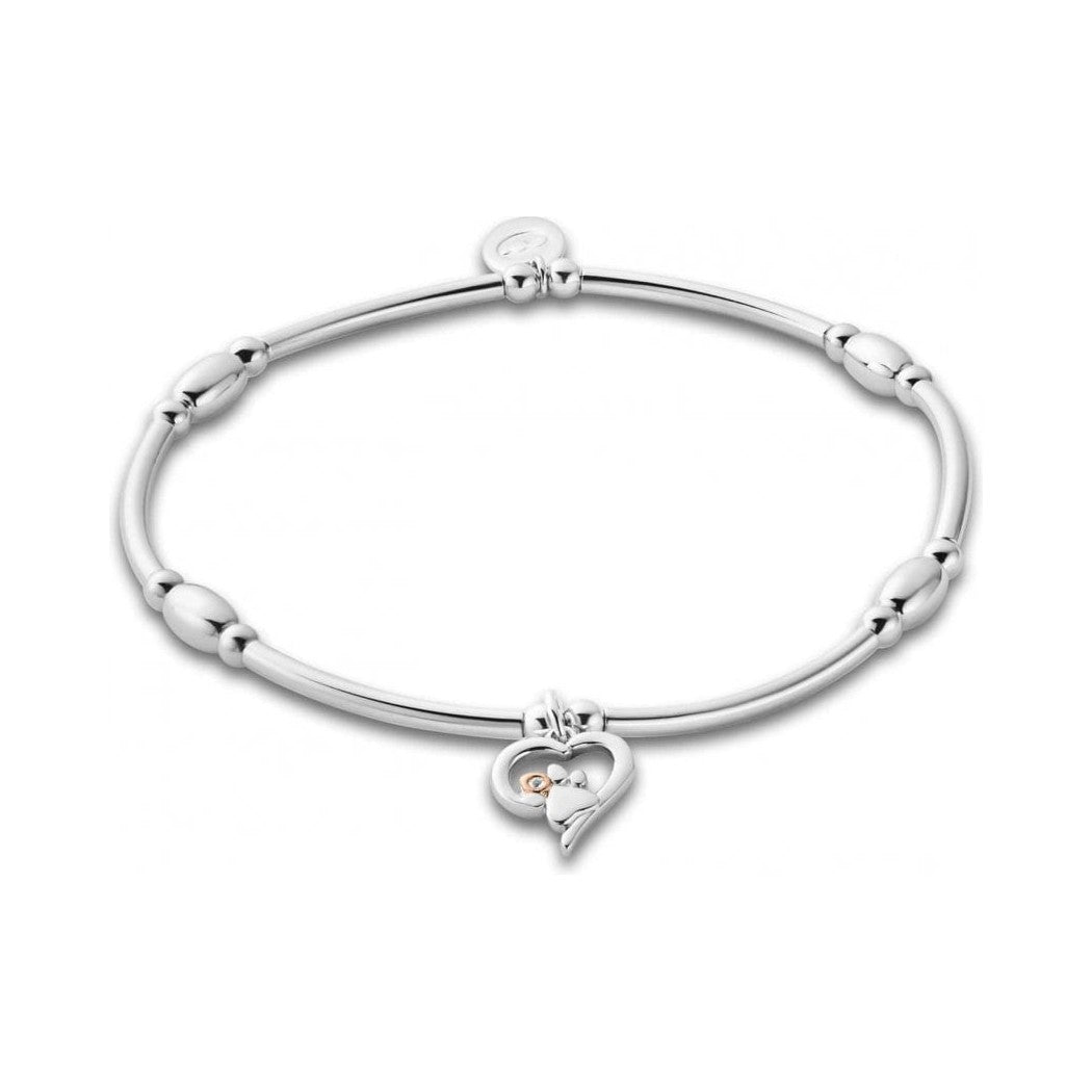 Silver charm bracelet with heart-shaped pendant. 
