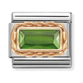 Nomination composable charm. Green baguette stone set in 9K rose gold on a steel link. Jewelry detail.