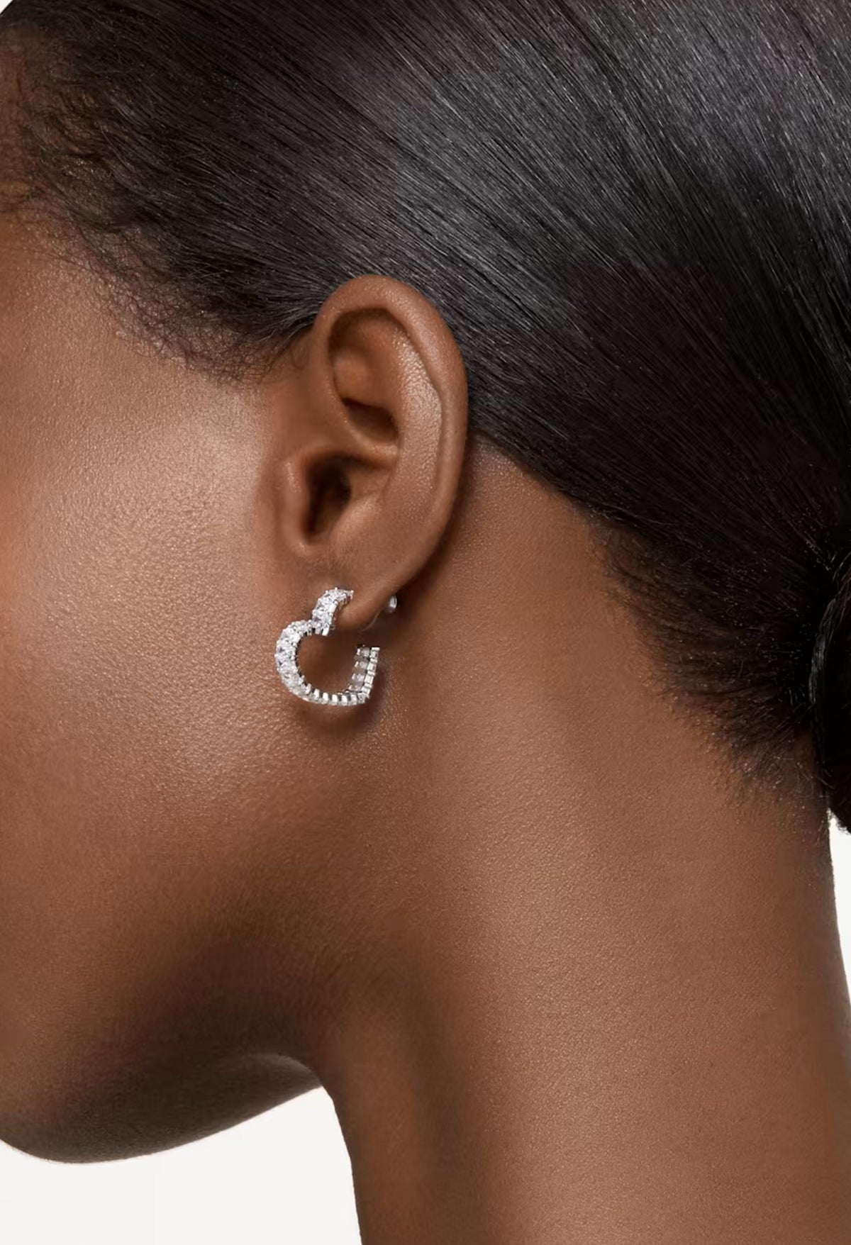 The Swarovski Matrix Small Heart Hoop Earrings, rhodium plated metal earrings from Swarovski, at OD’s Jewellers in St Helens.