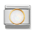 Silver charm with a gold-rimmed opal.
