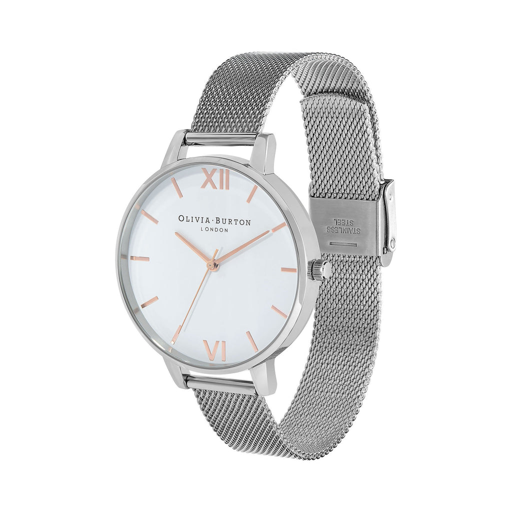 Olivia Burton watch featuring a white dial and stainless steel mesh strap, highlighting the watch's design.