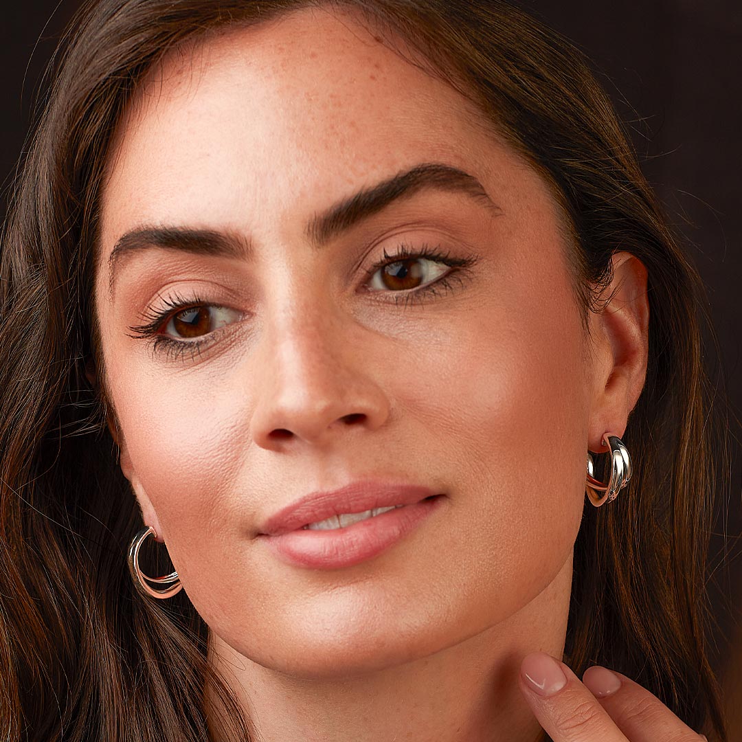 The Serenity Grande cross over semi hoop earrings, a silver metal earrings from Kit Heath, available at OD’s Jewellers in St Helens