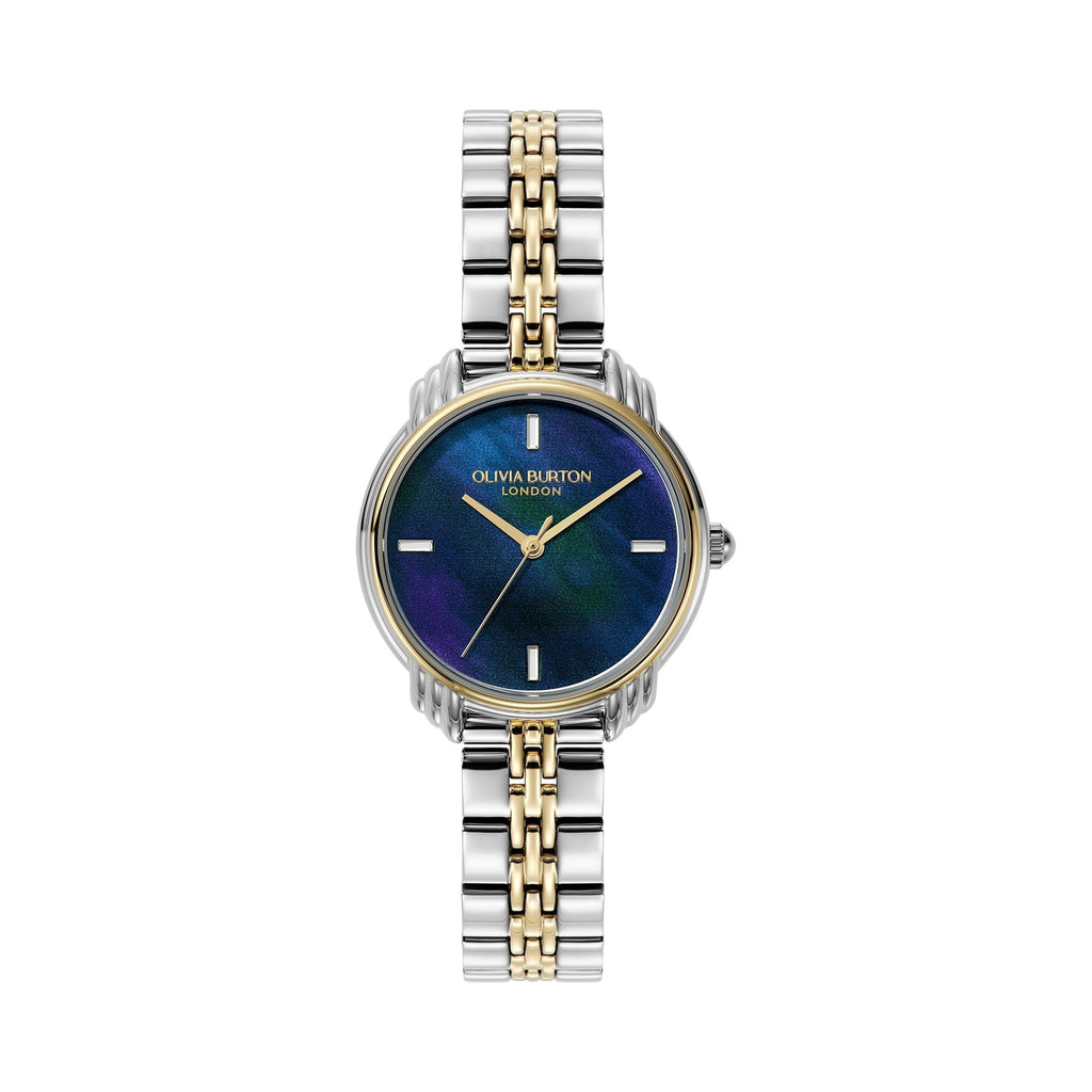 Close-up of a silver and gold Olivia Burton wristwatch with a blue and purple marbled face.