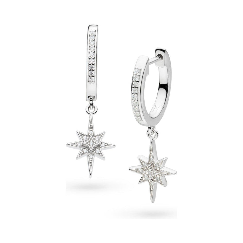 Two silver, diamond-studded hoop earrings with star pendants.