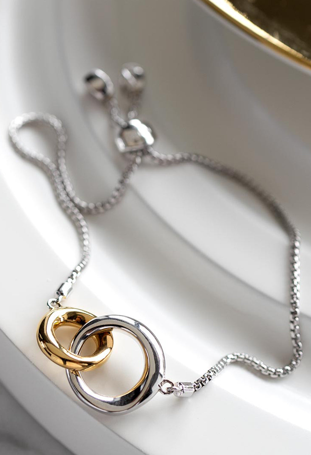 Kit Heath Bevel Cirque Link Golden Toggle Bracelet, a two-tone silver-gold plated bracelet from Kit Heath, at OD’s Jewellers in St Helens