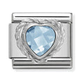 Close-up of a Nomination charm featuring a light blue, heart-shaped CZ stone in a steel composable link for personalized