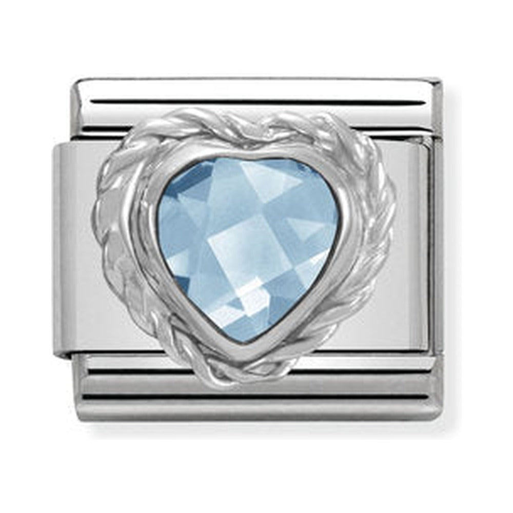 Close-up of a Nomination charm featuring a light blue, heart-shaped CZ stone in a steel composable link for personalized