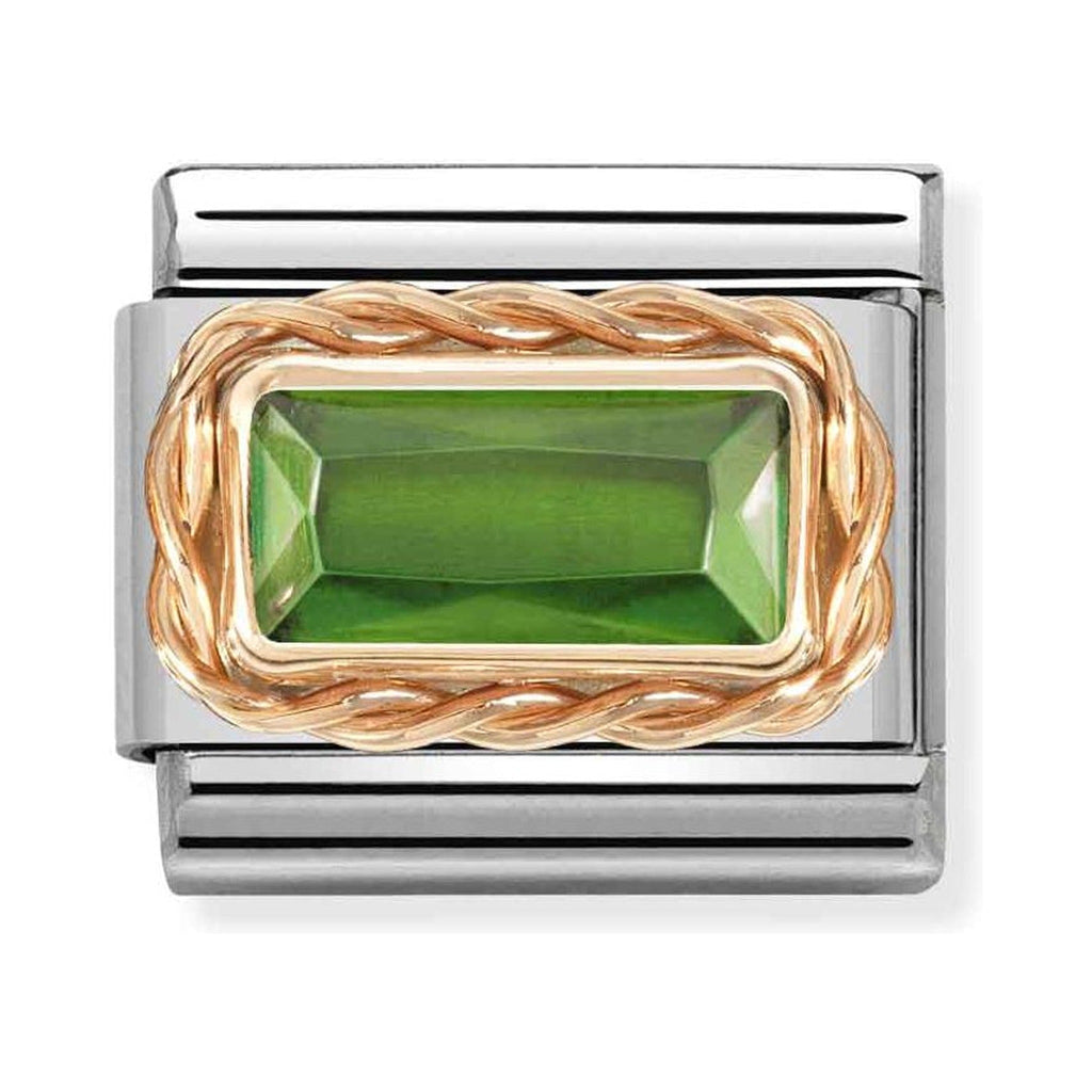 Nomination composable charm. Green baguette stone set in 9K rose gold on a steel link. Jewelry detail.