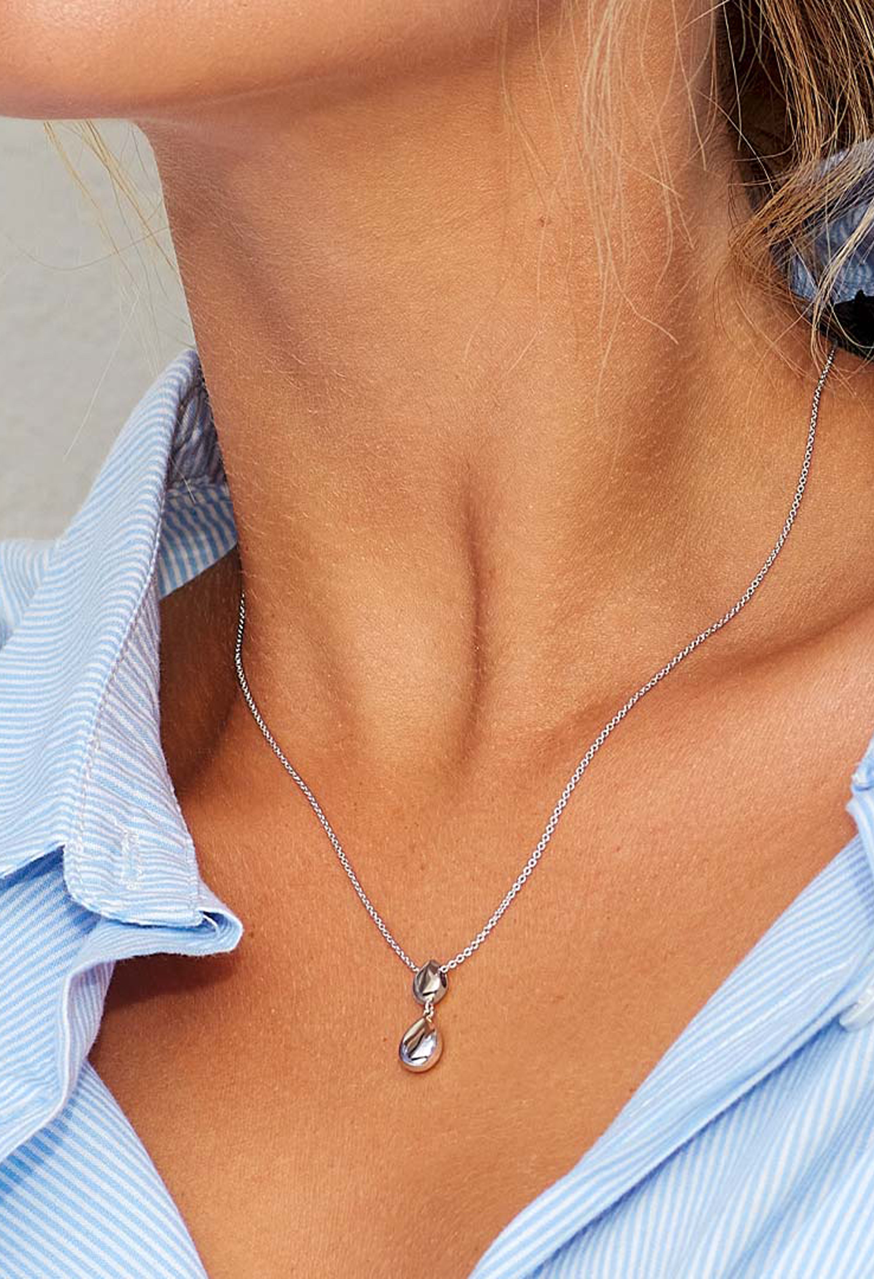 The Kit Heath Coast Pebble Double Droplet Necklace, a silver necklace from Kit Heath, available at OD’s Jewellers in St Helens.