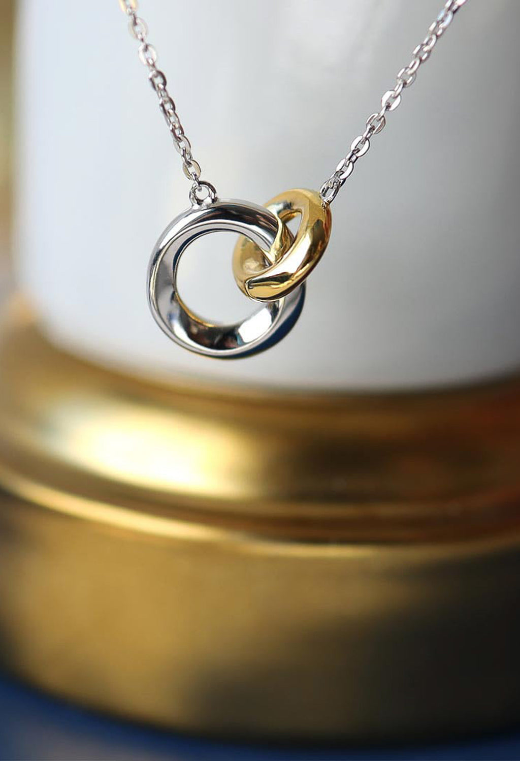 The Kit Heath Bevel Cirque Link Golden Necklace, a two-tone silver-gold plated jewellery necklace from Kit Heath, at OD’s Jewellers in St Helens.