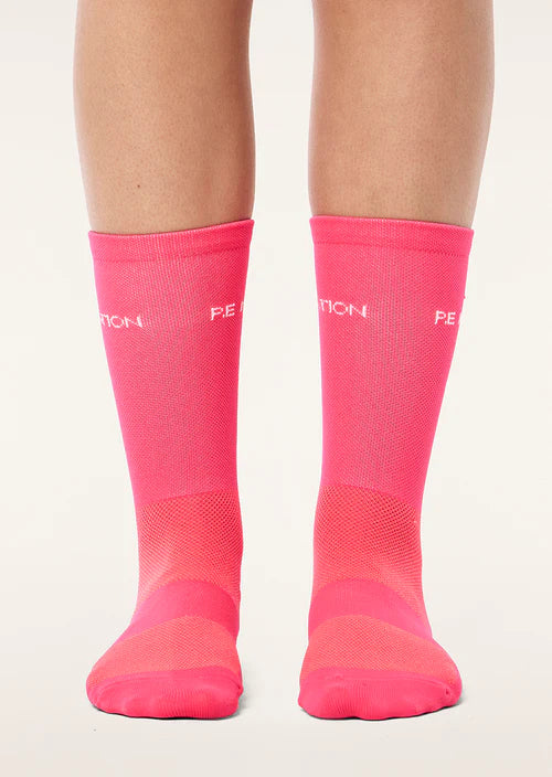 Pink socks with a brand logo on a white background