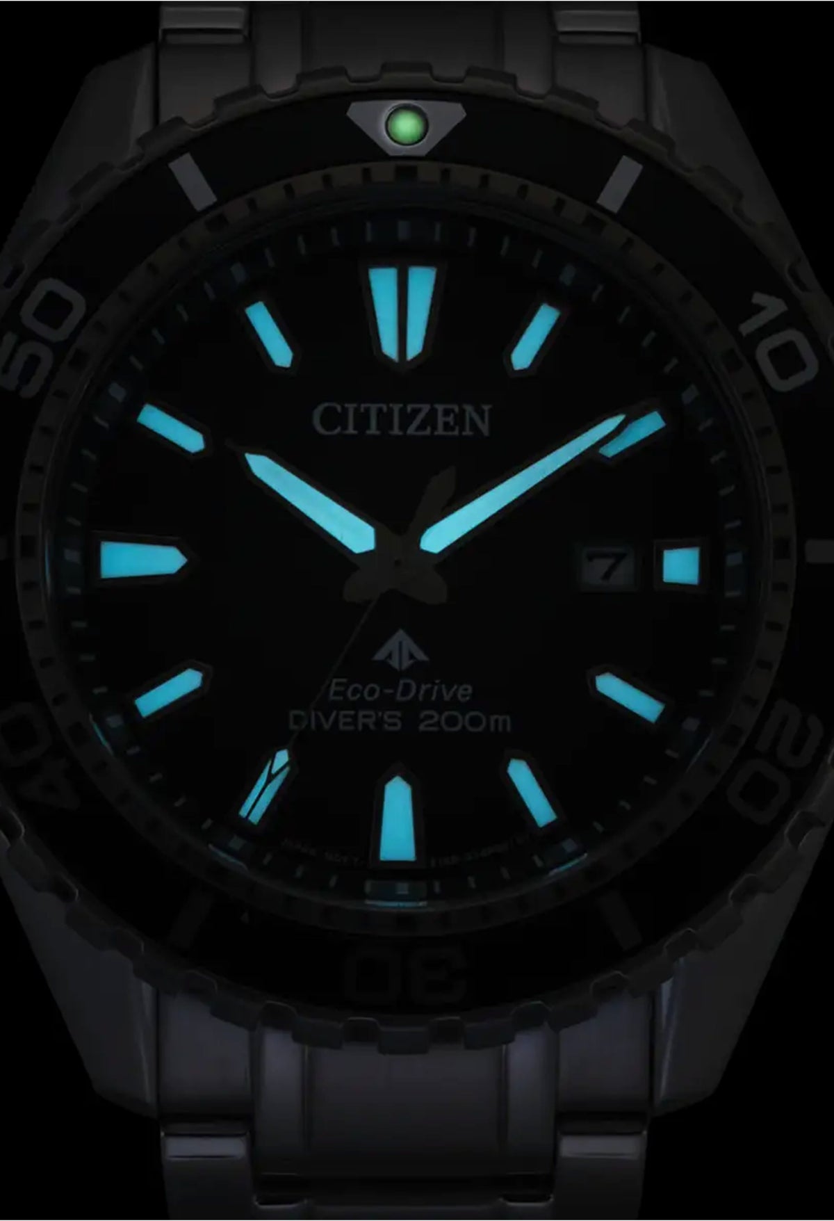 Citizen Promaster Diver's watch displaying luminous dial in darkness, highlighting time-telling and Eco-Drive feature.
