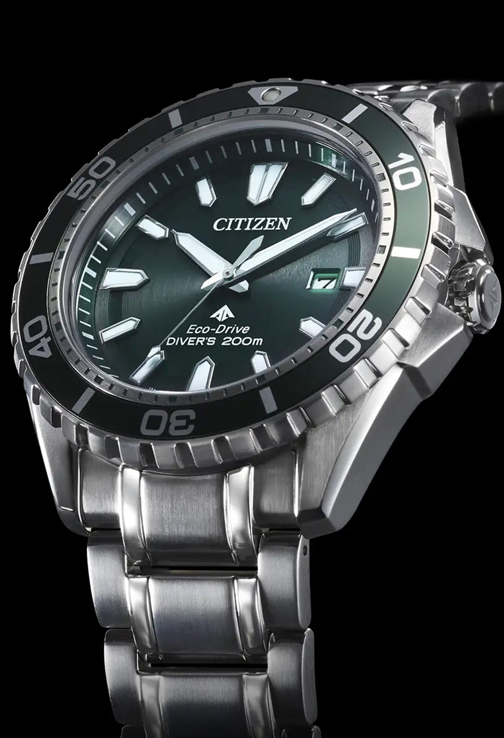 Close-up showcasing the Citizen Eco-Drive Promaster Diver watch, green dial with 200m water resistance, emphasizing style &
