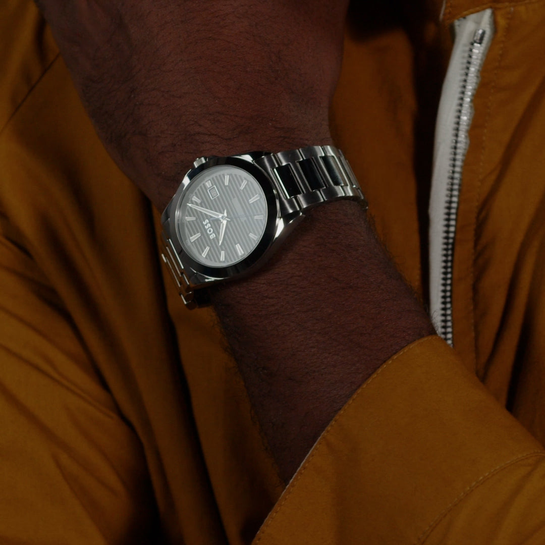 Close-up of BOSS Strike watch on wrist, showcasing the black lined dial and stainless steel design.