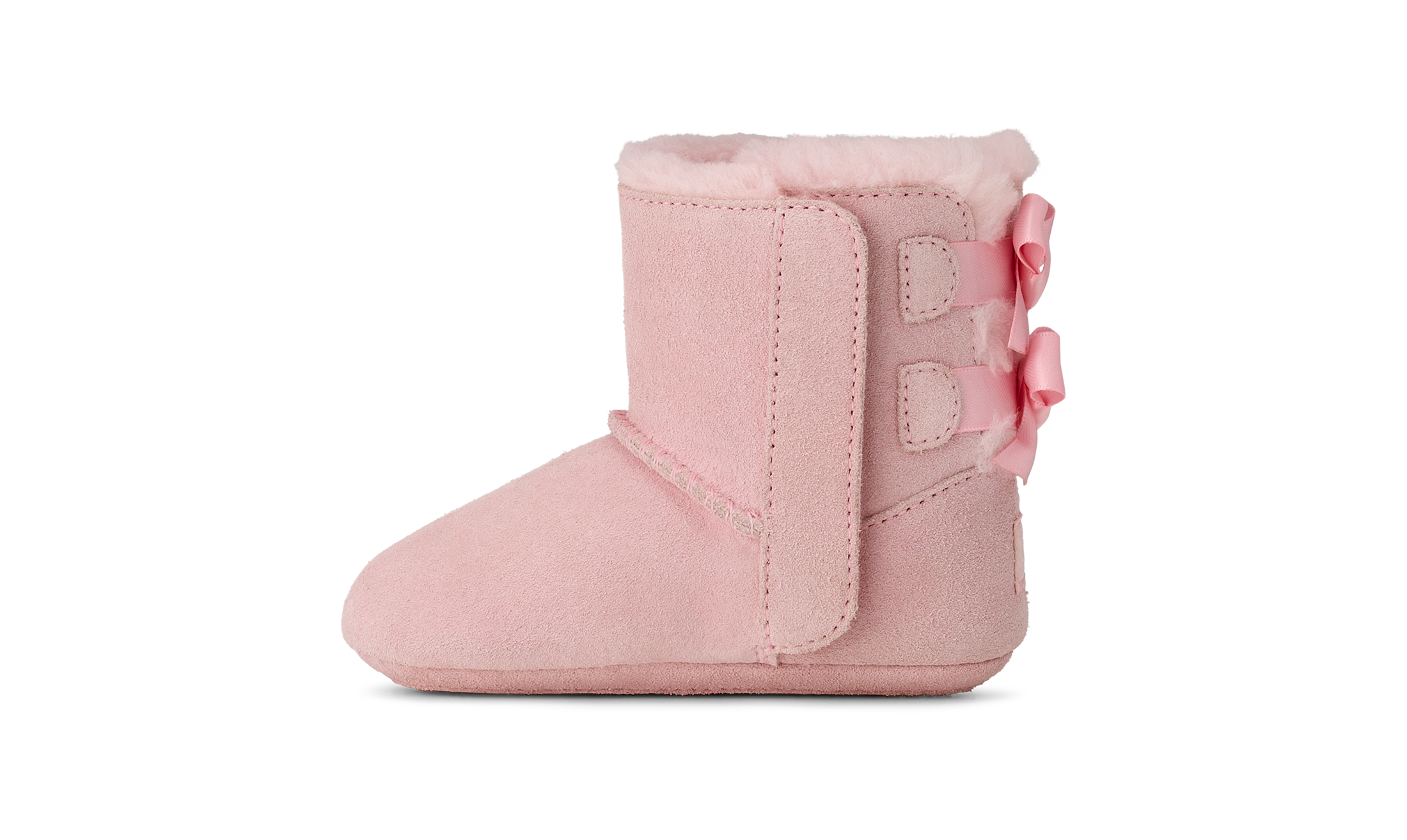Pink baby bootie with a bow on a white background