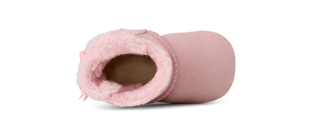 Pink baby bootie fluffy interior on a white background