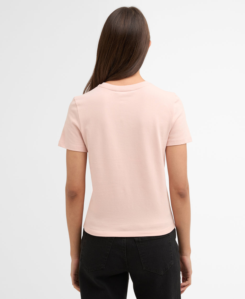 Woman wearing a light pink t-shirt on a white background