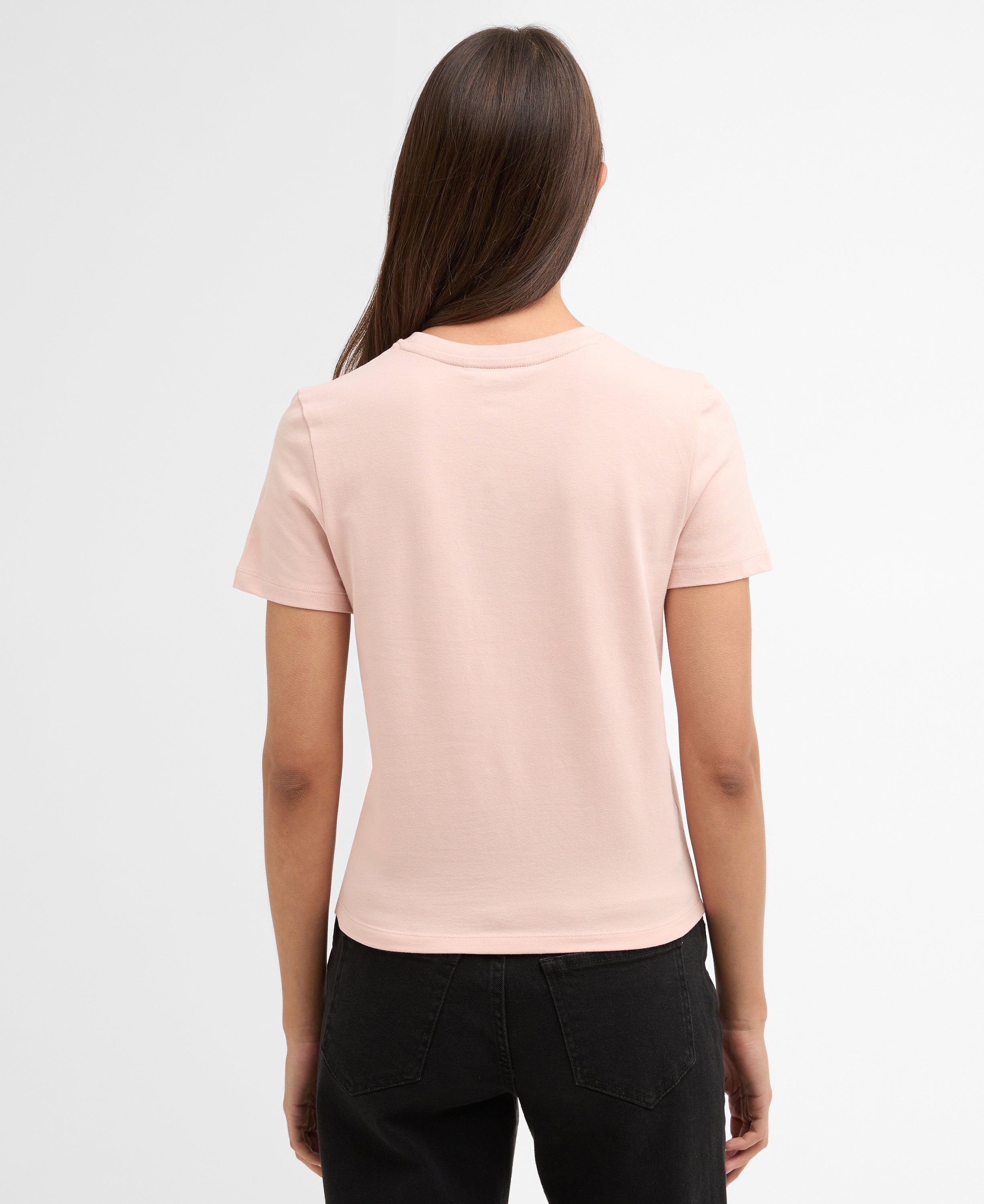 Woman wearing a light pink t-shirt on a white background