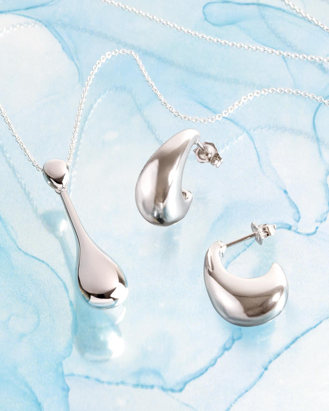 Coast Pebble Smooth Elegant Necklace on a styled background