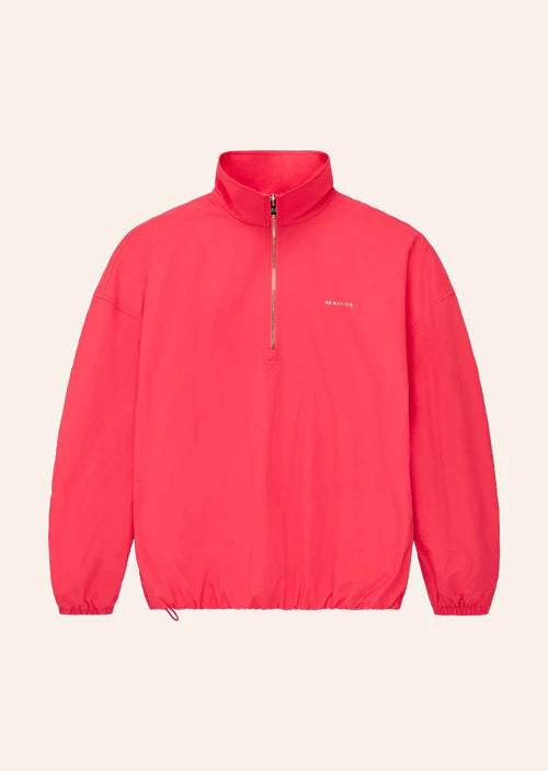 Red jacket with a brand logo on a light beige background