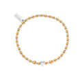 Gold and silver beaded bracelet with heart charm.

