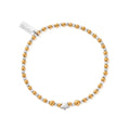 Gold and silver beaded bracelet with a star charm and tag.