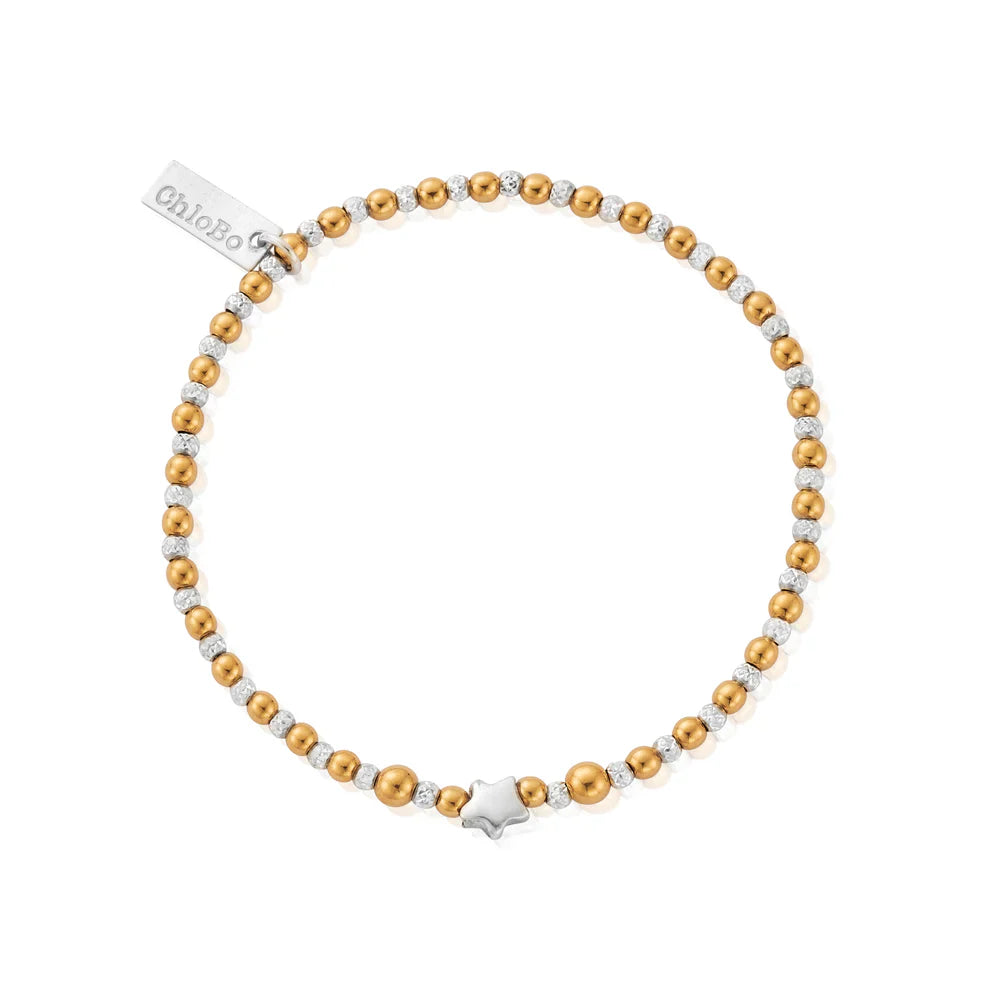 Gold and silver beaded bracelet with a star charm and tag.