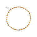 Gold and silver beaded bracelet with a star charm and tag.
