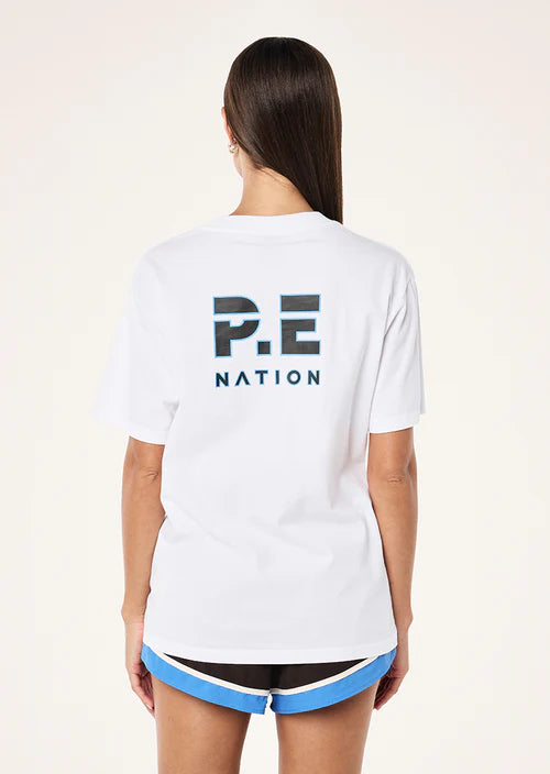 Person wearing a white 'P.E. Nation' t-shirt on a plain background