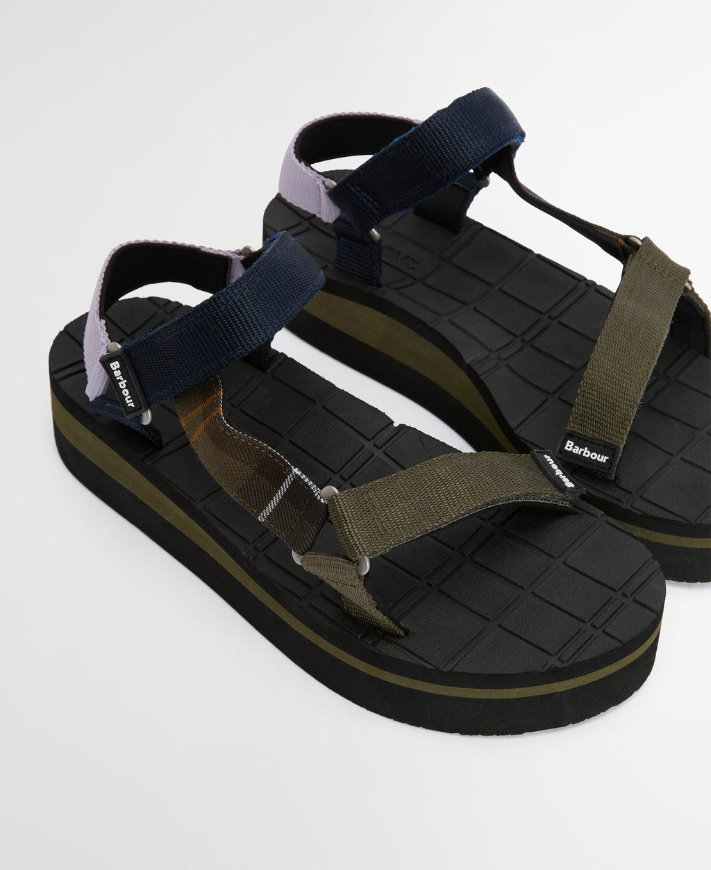 Black and green sandal with multiple straps on a white background