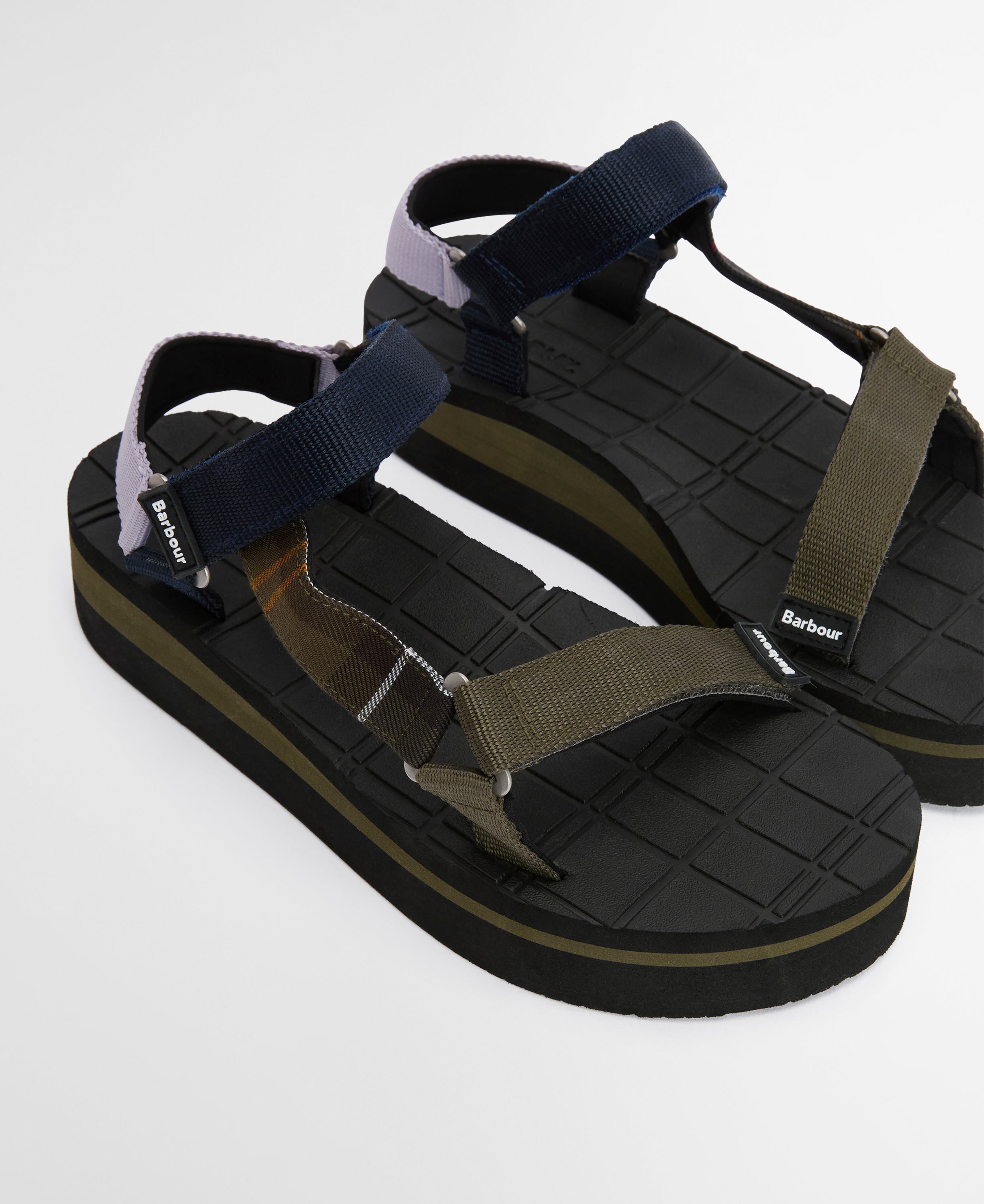 Black and green sandal with multiple straps on a white background