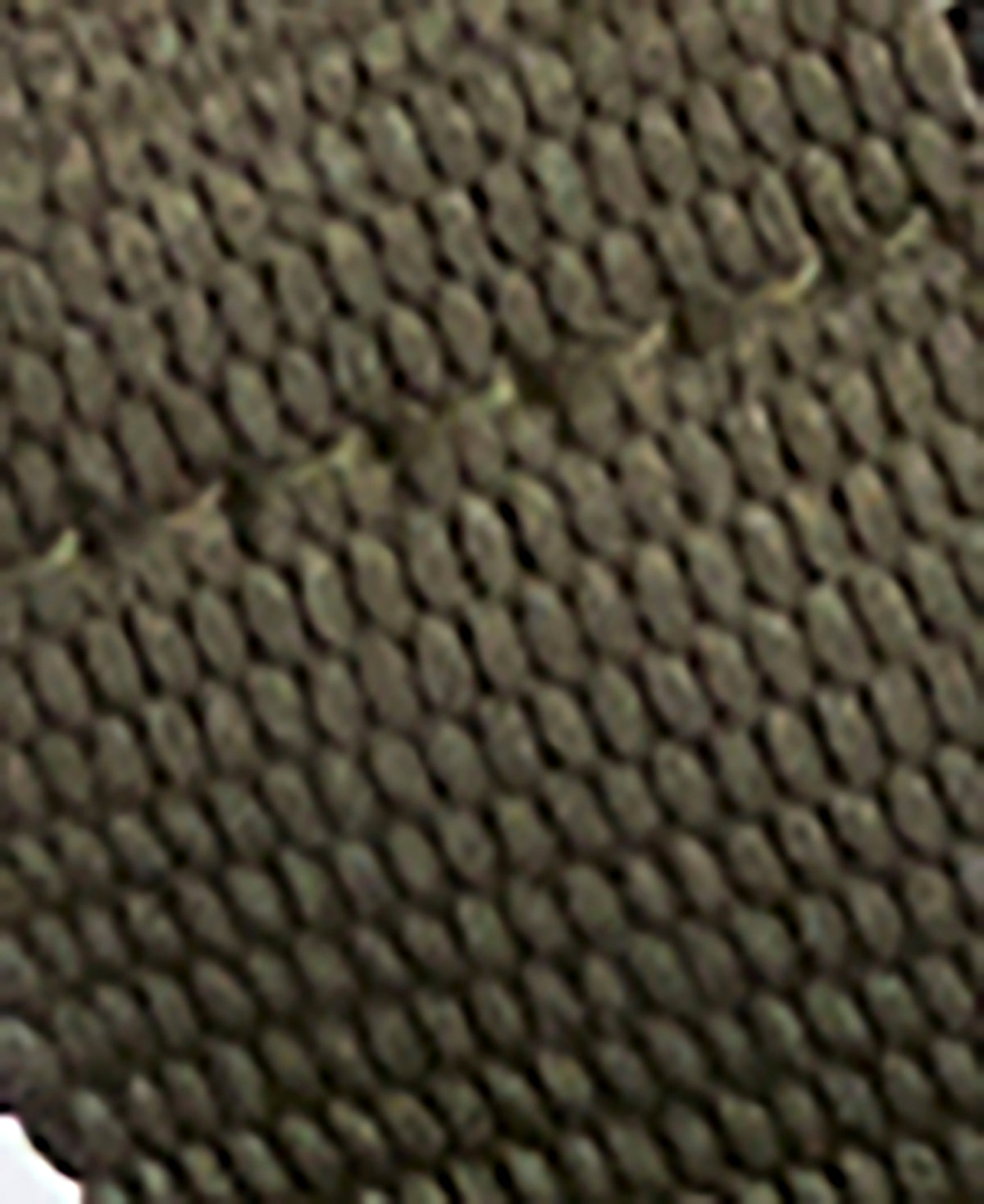 Close-up of a textured brown fabric surface
