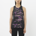 Woman wearing a black sleeveless top with colorful abstract design on a white background