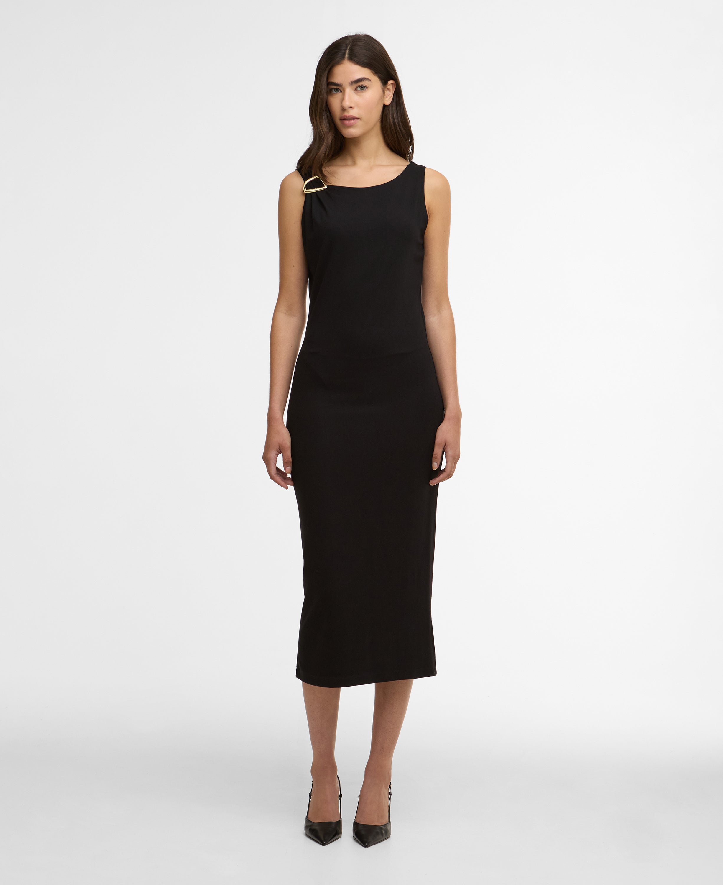 Woman wearing a black sleeveless dress on a white background