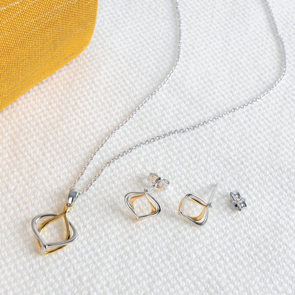The Alicia Golden Petite Stud Earrings, a silver and gold two tone earrings from Kit Heath, available at OD’s Jewellers in St Helens