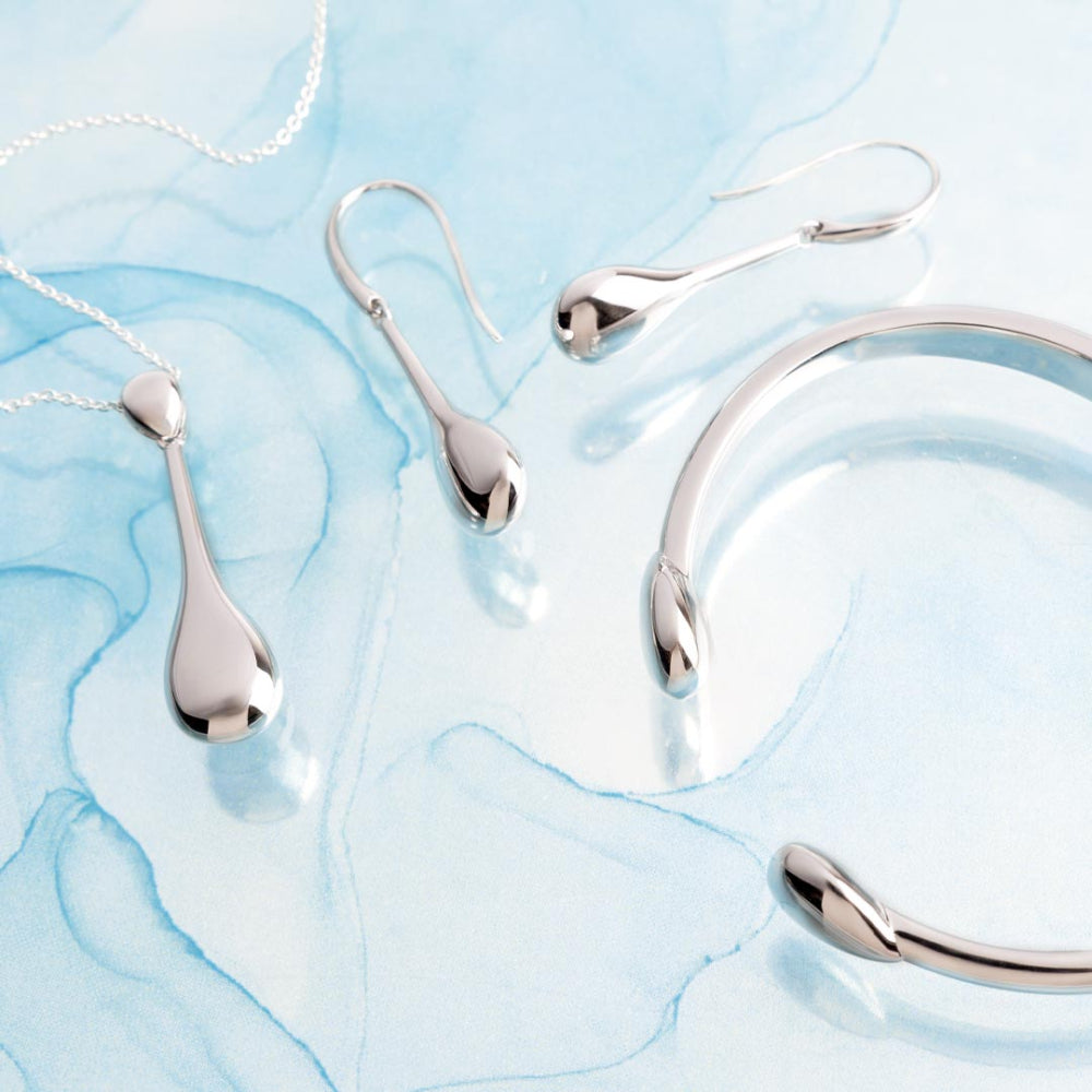 The Kit Heath Coast Pebble smooth elegant drop earring, a silver metal earring from Kit Heath, available at OD’s Jewellers in St Helens