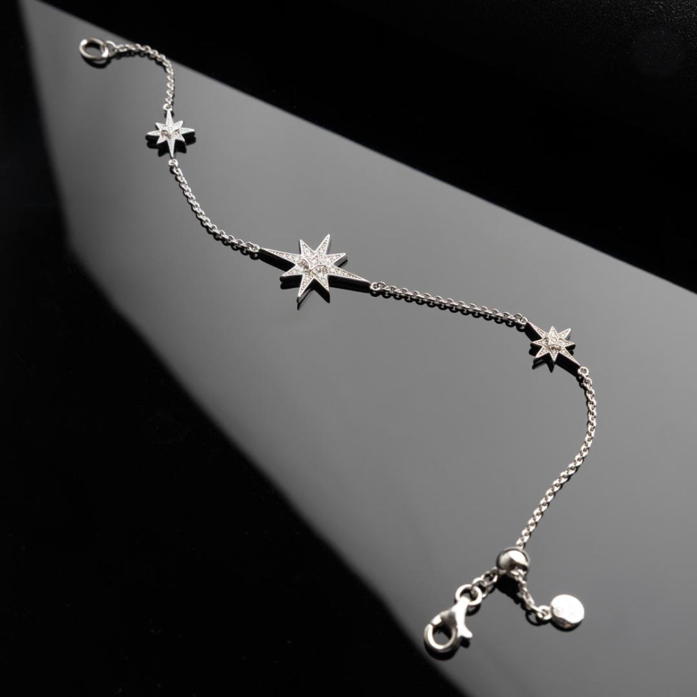 Silver star charm bracelet.
